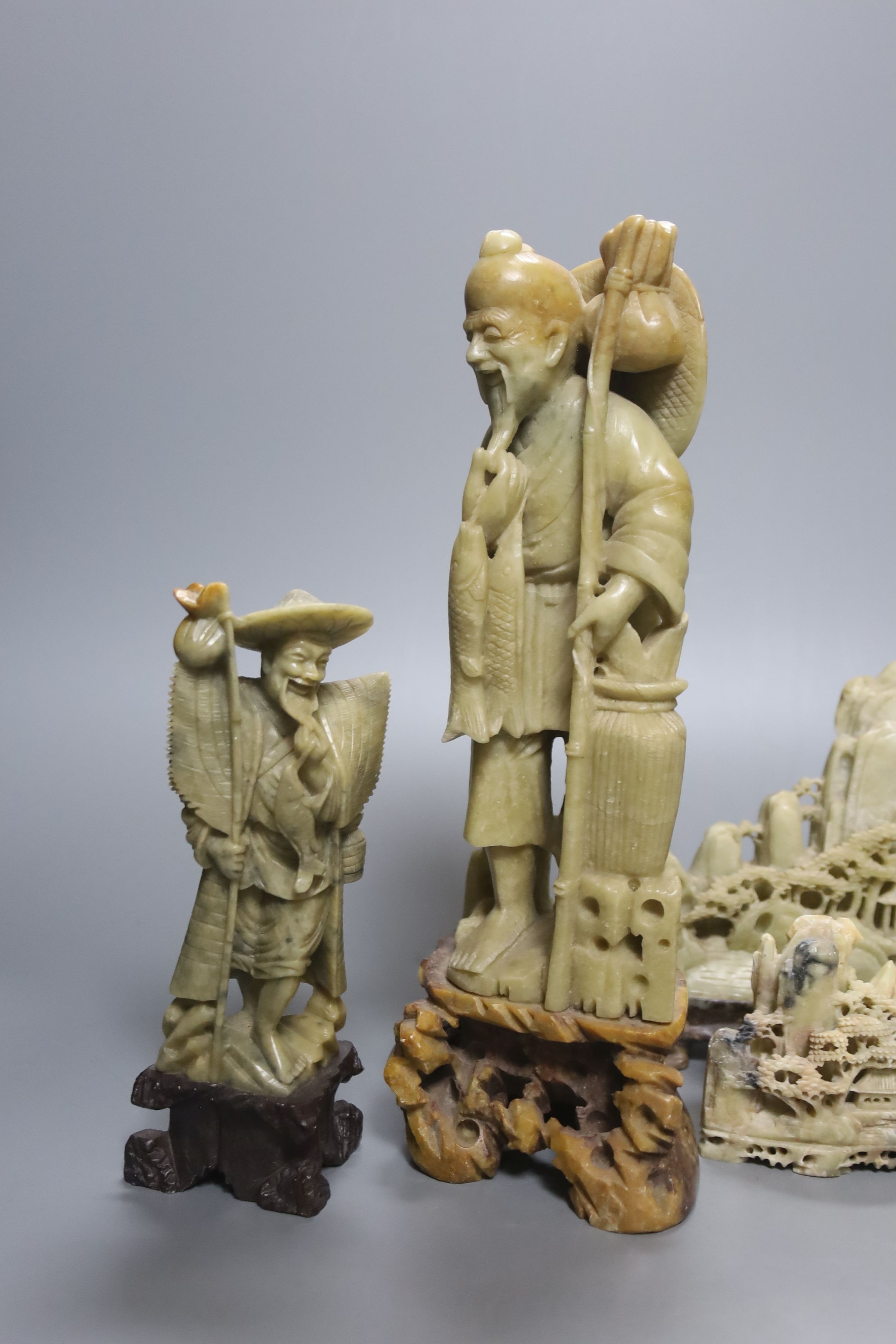 Seven Chinese soapstone carvings, 4 figurative carvings, largest 26 cms high including base.
